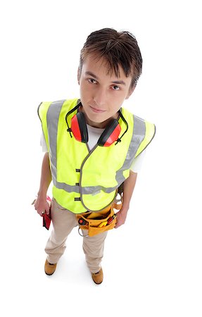 students working with tools - Young male builder apprentice tradesman rookie wearing protective work gear standing on a white background. Stock Photo - Budget Royalty-Free & Subscription, Code: 400-06560172