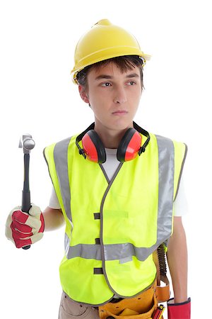students working with tools - Apprentice builder holding a hammer.  White background. Stock Photo - Budget Royalty-Free & Subscription, Code: 400-06560173