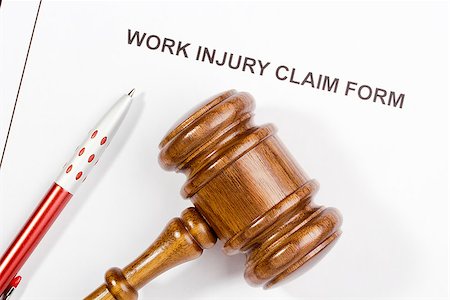 rimborso - Directly above photograph of a work injury claim form. Fotografie stock - Microstock e Abbonamento, Codice: 400-06560192