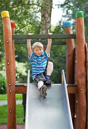 Little blond boy on an outdoor playground Stock Photo - Budget Royalty-Free & Subscription, Code: 400-06560402