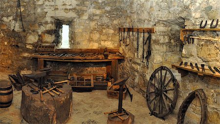 saft - museum exposition of an blacksmith workshop in a castle. panorama photo Stock Photo - Budget Royalty-Free & Subscription, Code: 400-06560568