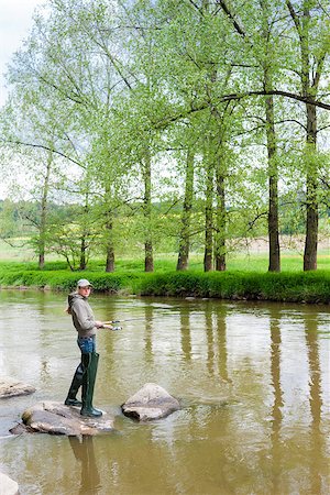 simsearch:400-06852239,k - woman fishing in Sazava river, Czech Republic Photographie de stock - Aubaine LD & Abonnement, Code: 400-06560820