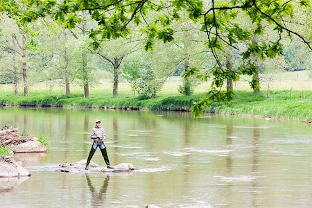 simsearch:400-06852239,k - woman fishing in Sazava river, Czech Republic Photographie de stock - Aubaine LD & Abonnement, Code: 400-06560822