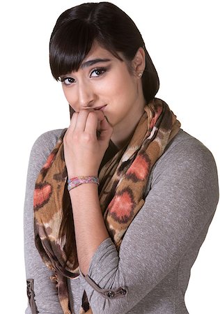 simsearch:400-06426527,k - Apologetic mixed woman with scarf biting fingernails Photographie de stock - Aubaine LD & Abonnement, Code: 400-06561361