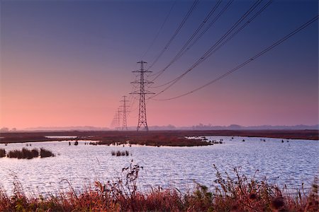 drenthe - high-voltage electricity line over lakes at early colorful sunrise Foto de stock - Royalty-Free Super Valor e Assinatura, Número: 400-06561556