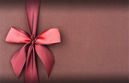 Cover a gift box with a red bow Stock Photo - Budget Royalty-Free & Subscription, Code: 400-06561584