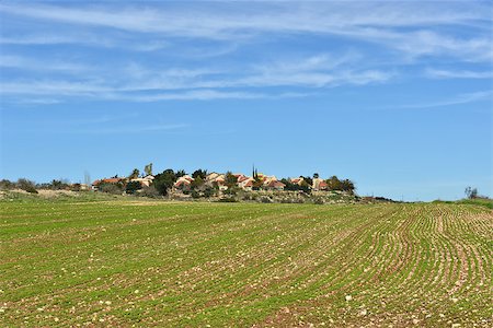 Blue sky, green fields and a small village. Stockbilder - Microstock & Abonnement, Bildnummer: 400-06561849