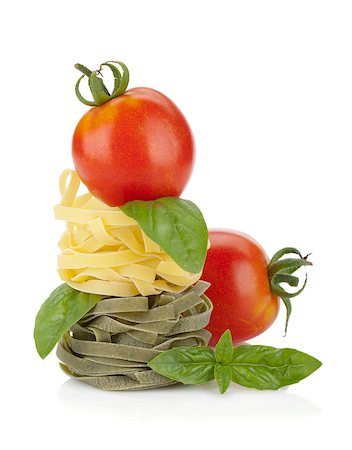 simsearch:400-05877069,k - Fettuccine nest pasta with tomato cherry and basil. Isolated on white background Foto de stock - Super Valor sin royalties y Suscripción, Código: 400-06562419