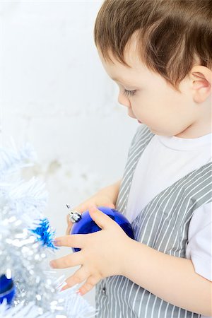 simsearch:400-07088886,k - beautiful happy small kid decorate christmas tree Stock Photo - Budget Royalty-Free & Subscription, Code: 400-06562575