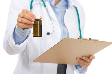 simsearch:400-07099832,k - Closeup on medical doctor woman with clipboard and medecine bottle Stock Photo - Budget Royalty-Free & Subscription, Code: 400-06562811