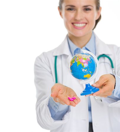 future protections to earth - Closeup on smiling medical doctor woman holding pills and globe Stock Photo - Budget Royalty-Free & Subscription, Code: 400-06562825