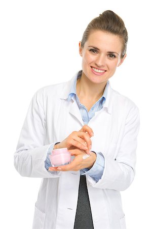 Smiling kosmetist woman applying creme on hand Stock Photo - Budget Royalty-Free & Subscription, Code: 400-06562848