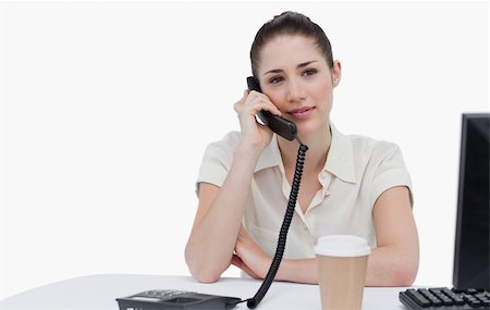 Secretary answering the phone against a white background Stock Photo - Budget Royalty-Free & Subscription, Code: 400-06627019