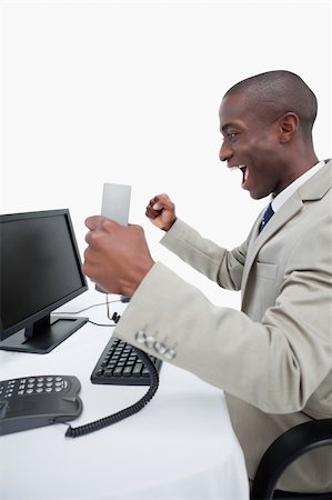 simsearch:400-06393704,k - Portrait of a cheerful businessman using a computer against a white background Stockbilder - Microstock & Abonnement, Bildnummer: 400-06627044