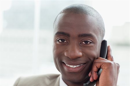 simsearch:400-05900712,k - Close up of a smiling businessman on the phone in his office Stock Photo - Budget Royalty-Free & Subscription, Code: 400-06627060