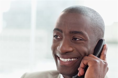 Close up of a happy businessman on the phone in his office Stock Photo - Budget Royalty-Free & Subscription, Code: 400-06627061