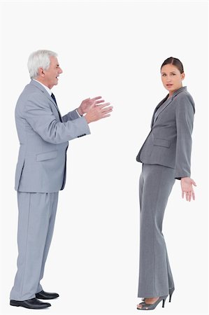 simsearch:649-07436826,k - Businesswoman getting accused by colleague against a white background Stock Photo - Budget Royalty-Free & Subscription, Code: 400-06627134