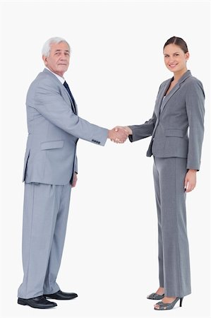 simsearch:400-04606211,k - Businessman and woman shaking hands against a white background Stockbilder - Microstock & Abonnement, Bildnummer: 400-06627133