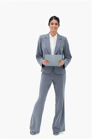 simsearch:400-06633122,k - Smiling businesswoman holding clipboard against a white background Stock Photo - Budget Royalty-Free & Subscription, Code: 400-06627228