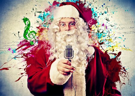 simsearch:400-06639922,k - Santa Claus holding an old microphone with some stains colors in the background Stock Photo - Budget Royalty-Free & Subscription, Code: 400-06628921