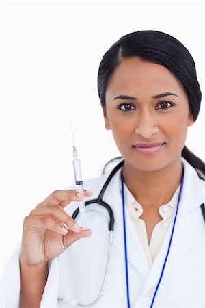 simsearch:400-06553842,k - Close up of female doctor with syringe against a white background Stockbilder - Microstock & Abonnement, Bildnummer: 400-06634013