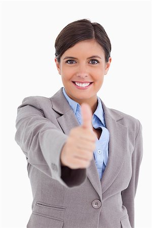 simsearch:400-05898224,k - Close up of female entrepreneur giving thumb up against a white background Foto de stock - Royalty-Free Super Valor e Assinatura, Número: 400-06634034