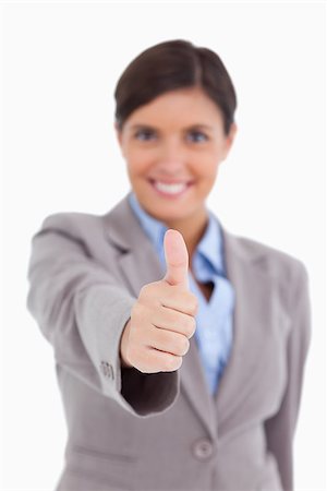 simsearch:400-05898224,k - Close up of thumb up being given by female entrepreneur against a white background Foto de stock - Royalty-Free Super Valor e Assinatura, Número: 400-06634033