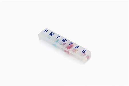 simsearch:700-07110852,k - Weekly pill organzier against a white background Photographie de stock - Aubaine LD & Abonnement, Code: 400-06634096