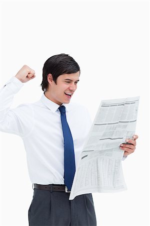 Celebrating tradesman looking at the news against a white background Photographie de stock - Aubaine LD & Abonnement, Code: 400-06634145