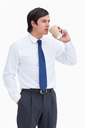 Tradesman drinking coffee out of a paper cup against a white background Stock Photo - Budget Royalty-Free & Subscription, Code: 400-06634160