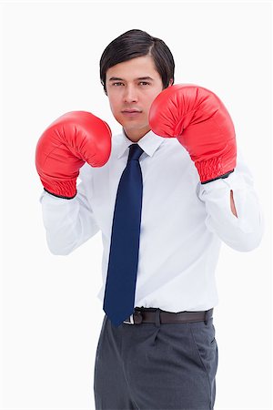 simsearch:400-05718453,k - Young tradesman with boxing gloves against a white background Stock Photo - Budget Royalty-Free & Subscription, Code: 400-06634216