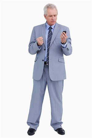 simsearch:400-05900688,k - Mature tradesman giving his cellphone an angry look against a white background Foto de stock - Super Valor sin royalties y Suscripción, Código: 400-06634264