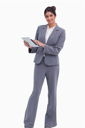 sales person with a tablet - Smiling female entrepreneur with her tablet computer against a white background Photographie de stock - Aubaine LD & Abonnement, Code: 400-06634353