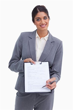 simsearch:400-06633122,k - Smiling female entrepreneur asking for signature against a white background Stock Photo - Budget Royalty-Free & Subscription, Code: 400-06634372