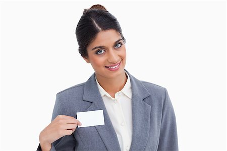 simsearch:400-06633122,k - Smiling female entrepreneur pointing at name sign against a white background Stock Photo - Budget Royalty-Free & Subscription, Code: 400-06634433