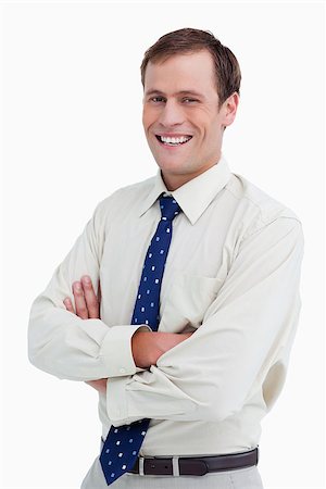 simsearch:400-04688280,k - Close up of smiling businessman with arms folded against a white background Stock Photo - Budget Royalty-Free & Subscription, Code: 400-06634455