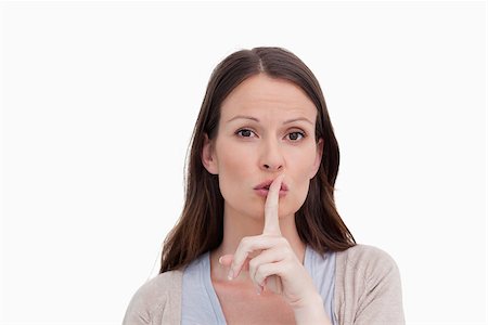 simsearch:6109-06194921,k - Woman asking for silence against a white background Stock Photo - Budget Royalty-Free & Subscription, Code: 400-06634520