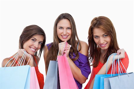 simsearch:400-06634629,k - Teenagers coming back from shopping with pride Fotografie stock - Microstock e Abbonamento, Codice: 400-06634591