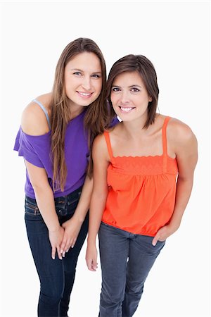 simsearch:400-06634629,k - Two teenagers leaning their bodies forward Fotografie stock - Microstock e Abbonamento, Codice: 400-06634625