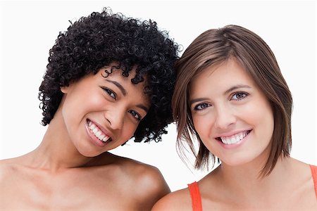 simsearch:400-06634629,k - Teenagers smiling and posing against a colourless background Fotografie stock - Microstock e Abbonamento, Codice: 400-06634672