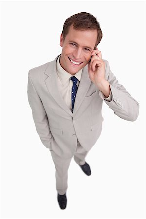 simsearch:400-06686562,k - Close up of smiling businessman scratching his head against a white background Foto de stock - Super Valor sin royalties y Suscripción, Código: 400-06634809