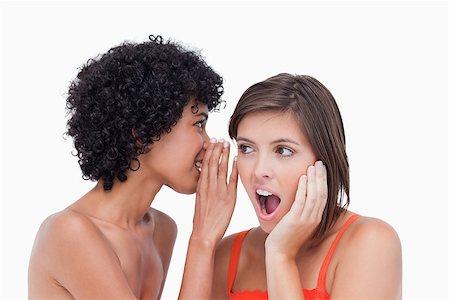 simsearch:400-06634629,k - Attractive teenager hearing a surprising secret from her best friend Fotografie stock - Microstock e Abbonamento, Codice: 400-06634886