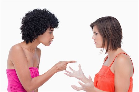 simsearch:400-06634629,k - Teenager pointing her finger on a friend while blaming her Fotografie stock - Microstock e Abbonamento, Codice: 400-06634888