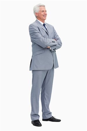 Smiling man in a suit with folded arms against white babckground Stock Photo - Budget Royalty-Free & Subscription, Code: 400-06636175