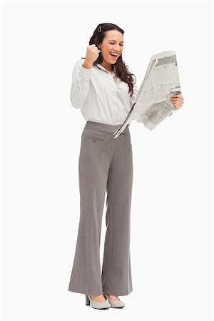 Enthusiastic employee reading the news against white background Stock Photo - Budget Royalty-Free & Subscription, Code: 400-06636575