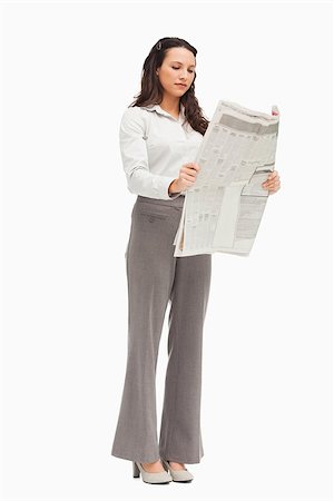 Employee reading the news against white background Stock Photo - Budget Royalty-Free & Subscription, Code: 400-06636572