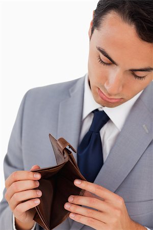 empty wallet - Man in a suit showing his empty wallet against white background Stock Photo - Budget Royalty-Free & Subscription, Code: 400-06636763
