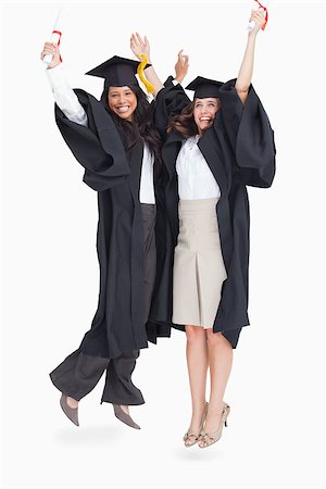 people graduation jump - A full length shot of two women jumping in celebration after graduating Stock Photo - Budget Royalty-Free & Subscription, Code: 400-06637869