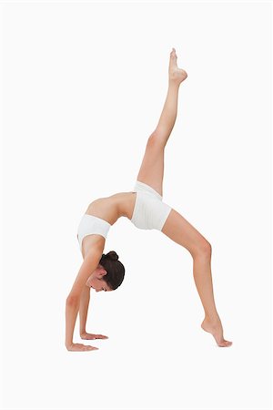 posición de rueda - Woman in gymnastic position against white background Foto de stock - Super Valor sin royalties y Suscripción, Código: 400-06638152