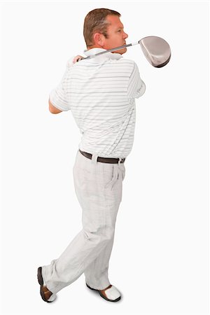 Side view of golfer against a white background Stock Photo - Budget Royalty-Free & Subscription, Code: 400-06638357